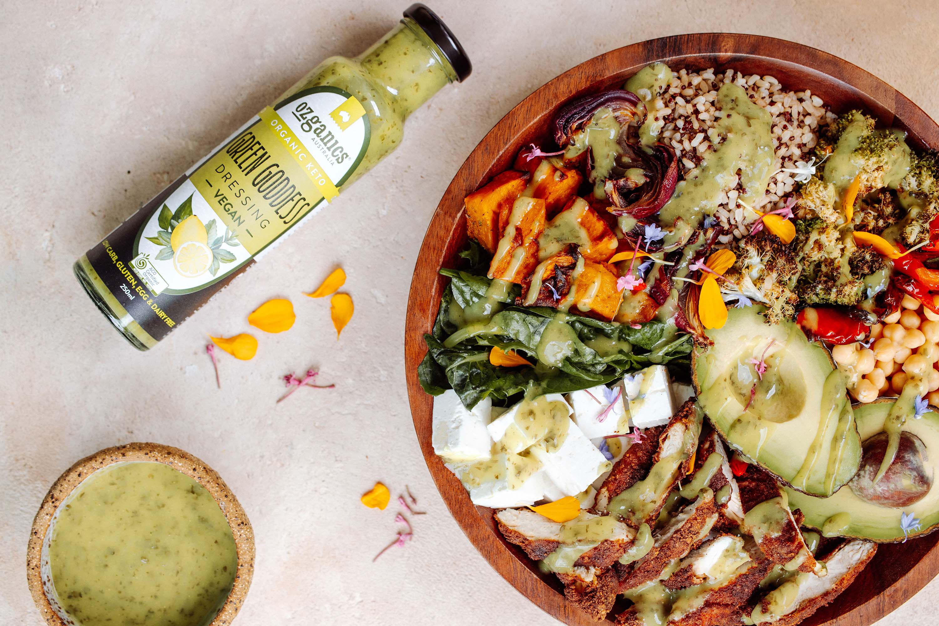 Ozganics Green Goddess organic salad dressing with a healthy bowl of salad